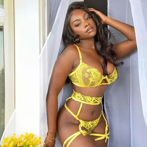 Ebony escort girl offers tantric massage Las Vegas while wearing revealing string bikini.